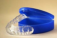 A clear dental night guard sits on an open blue case at Carpinello Orthodontics in Drexel Hill, Newtown Square or Edgmont, PA.