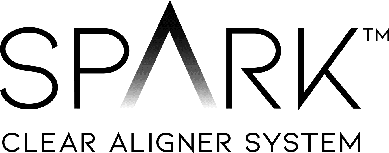 A smiling girl holds and points to an Invisalign Teen aligner with Carpinello Orthodontics in Drexel Hill, Newtown Square or Edgmont, PA, on a blue background. A smiling girl holds and points to an Invisalign Teen aligner with Carpinello Orthodontics in Drexel Hill, Newtown Square or Edgmont, PA, on a blue background.