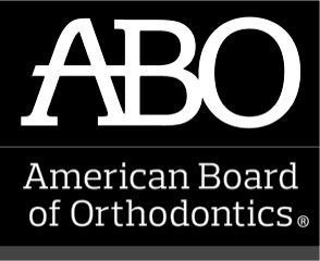 A smiling girl holds and points to an Invisalign Teen aligner with Carpinello Orthodontics in Drexel Hill, Newtown Square or Edgmont, PA, on a blue background. A smiling girl holds and points to an Invisalign Teen aligner with Carpinello Orthodontics in Drexel Hill, Newtown Square or Edgmont, PA, on a blue background.