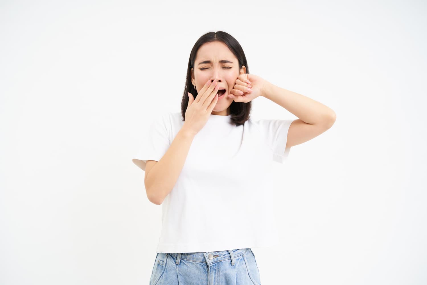 A woman yawning and stretching, showing signs of mouth breathing or sleep apnea, at Carpinello Orthodontics in Drexel Hill, Newtown Square or Edgmont, PA.