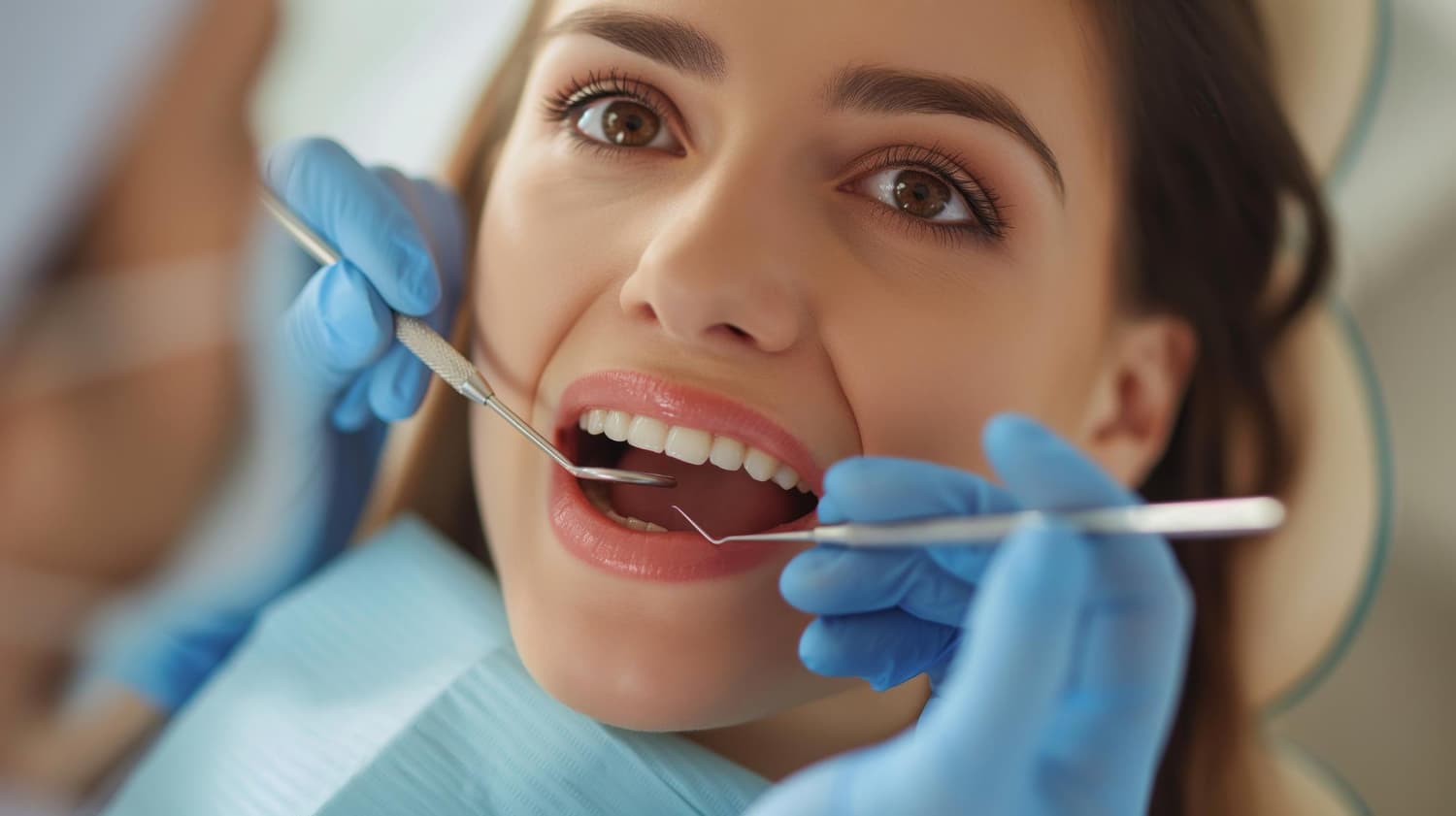 At Carpinello Orthodontics in Drexel Hill, Newtown Square or Edgmont, PA, a dentist examines teeth and discusses braces payment plans.