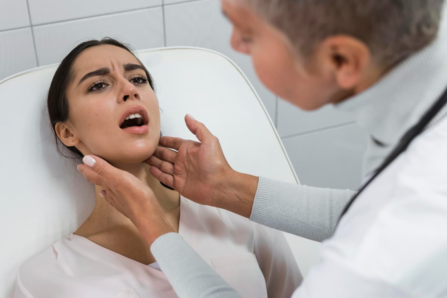 A woman is examined for post-jaw surgery rehab at Carpinello Orthodontics in Drexel Hill, Newtown Square or Edgmont, PA.