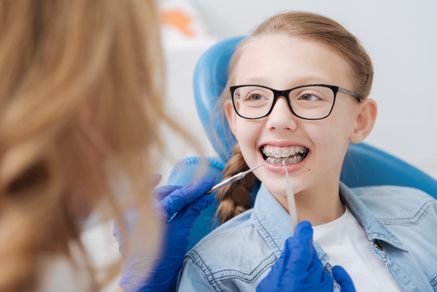 A young girl with braces finding the right pediatric orthodontist at Carpinello Orthodontics in Drexel Hill, Newtown Square or Edgmont, PA.