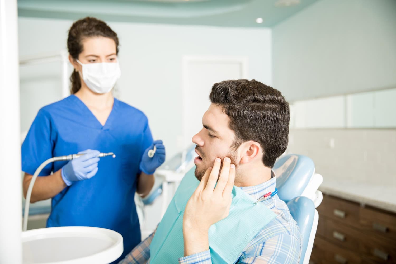 At Carpinello Orthodontics in Drexel Hill, Newtown Square or Edgmont, PA, a dentist consults with a patient about jaw surgery.