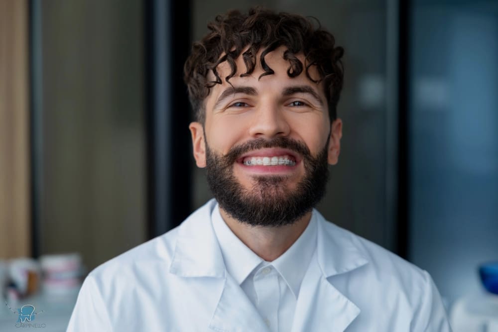 bearded man dentist clear braces showing importance dental care - How Long Do Braces Take in Drexel Hill, PA