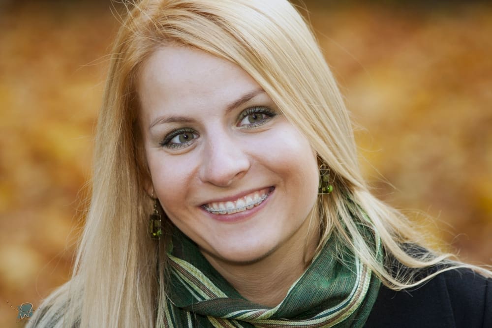 smiling blond young woman with clear braces - Alternatives to Braces in Drexel Hill, Newtown Square, and Edgmont, PA.  